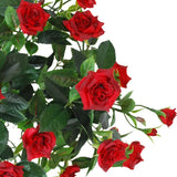 Een Kunstplant Patio-roos, 35 cm, in rood/zwart, met levensechte, levendig rode rozen met groene bladeren aan stelen, tegen een witte achtergrond.