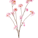 De Kunstbloem Kersenbloesem 114 cm roze heeft meerdere slanke bruine stelen met trosjes zachtroze kersenbloesembloemen tegen een effen witte achtergrond.