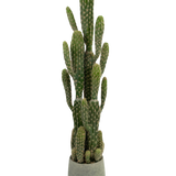 De Kunst Cactus 100 cm heeft hoge, groene, rechtopstaande armen met ribbels, in een ronde grijze pot tegen een effen witte achtergrond.