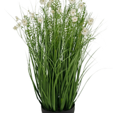 De Kunstgras witte Gesang Bloem uiengraspot is een 90cm brandvertragende kunstplant met lange, dunne groene bladeren en delicate witte bloemen in een ronde zwarte pot, tegen een effen witte achtergrond.
